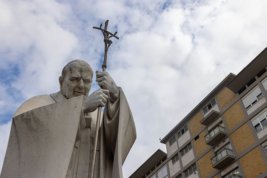 A JP2 statue stands before Pope Francis's hospital room